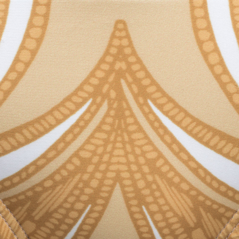 swimsuit fabric close up in a yellow paisley print