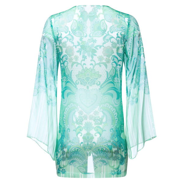 back of a mini silk kaftan with a deep v neckline in an emerald print