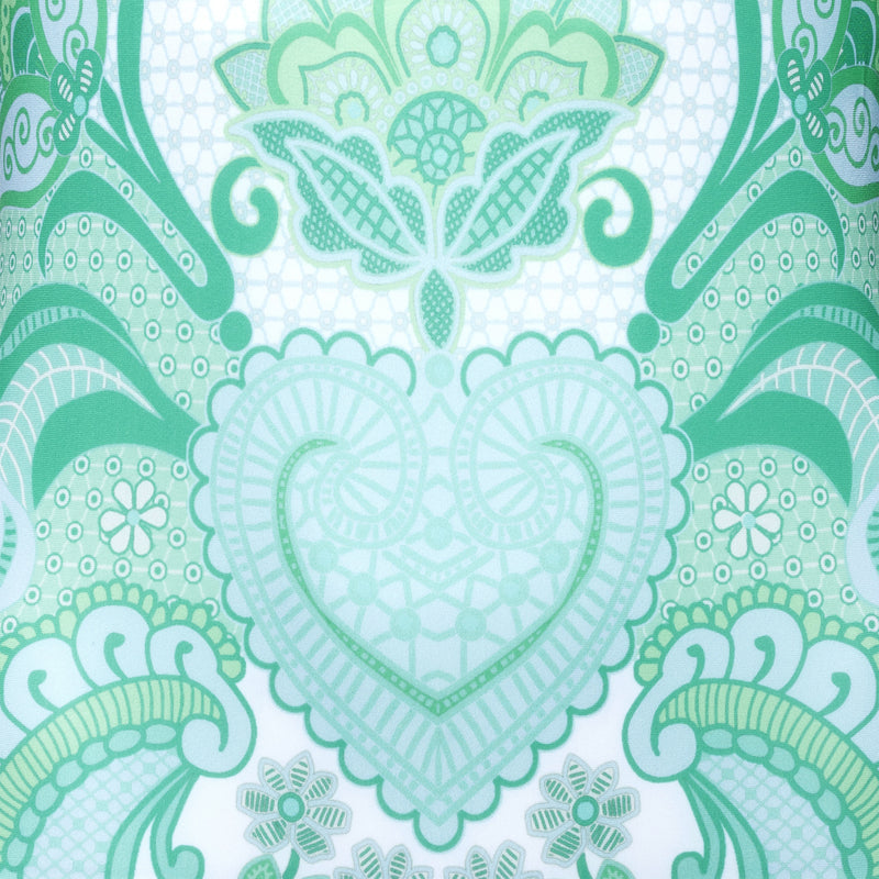 swimsuit fabric close up in an emerald print